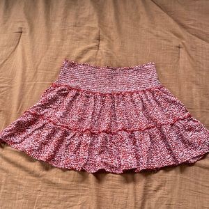 Red mini skirt it says large but it fits like a small, floral details